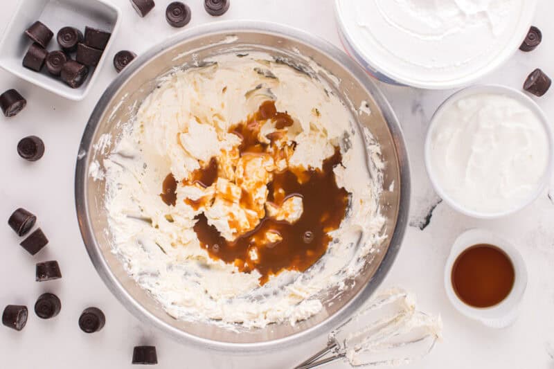 Cheesecake batter ingredients in a mixing bowl.