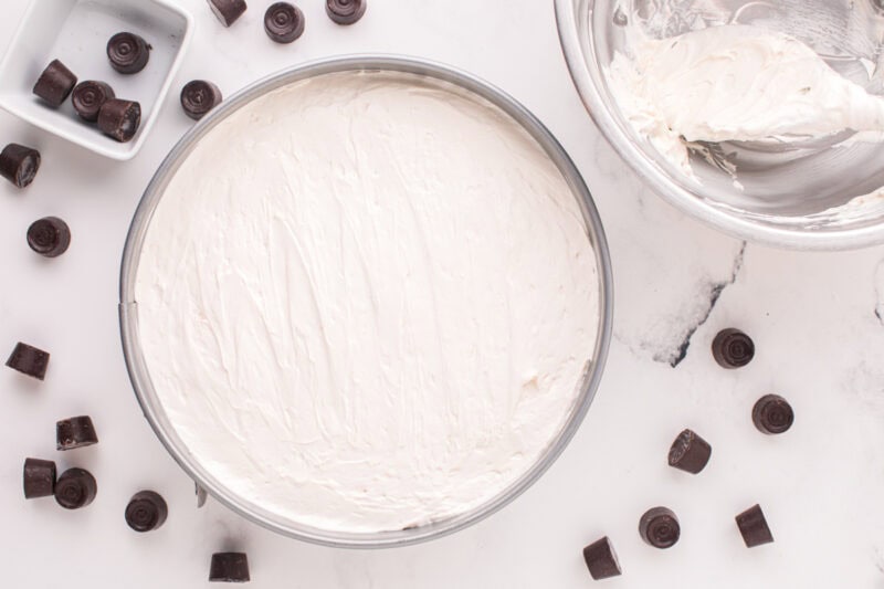 Cheesecake filling spread into a springform pan.