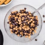 Chocolate chips and peanut butter chips combined in a small bowl.