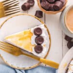 A slice of no bake rolo cheesecake on a plate.