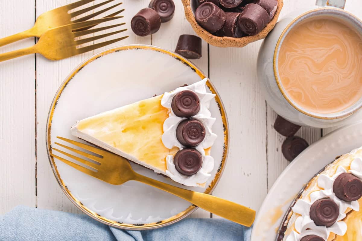 A slice of no bake rolo cheesecake on a plate.