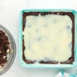 Sweetened condensed milk added on top of cake mix brownie batter.