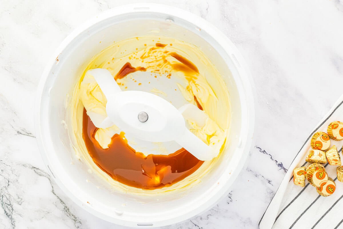 Adding caramel sauce to butter.
