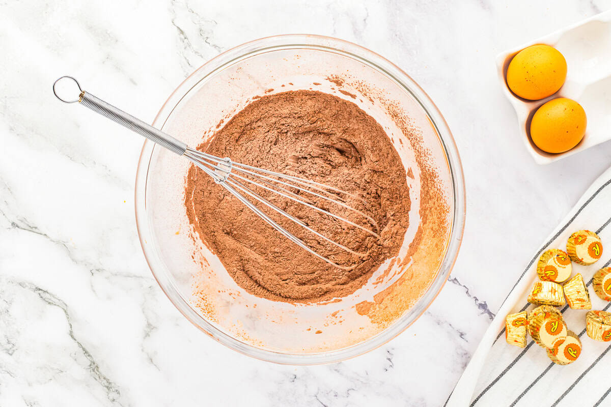Whisking together dry ingredients.