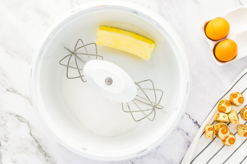 Beating butter and sugar.