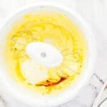 Mixing vanilla into butter mixture.