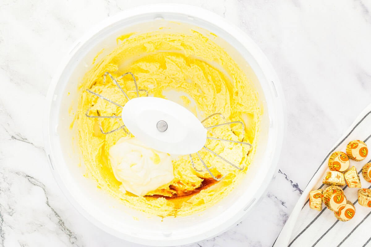 Mixing vanilla into butter mixture.