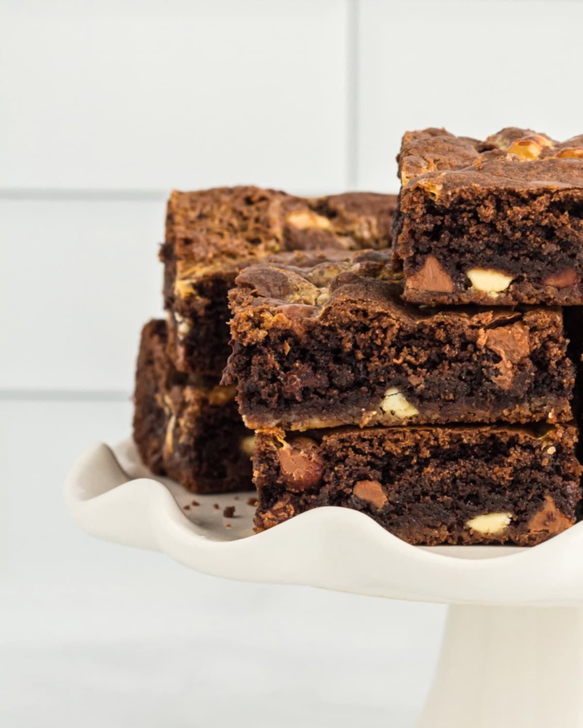 Close up on a stake of gooey chocolate cake mix brownies.